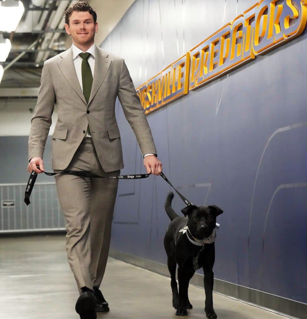 hockey player with dog